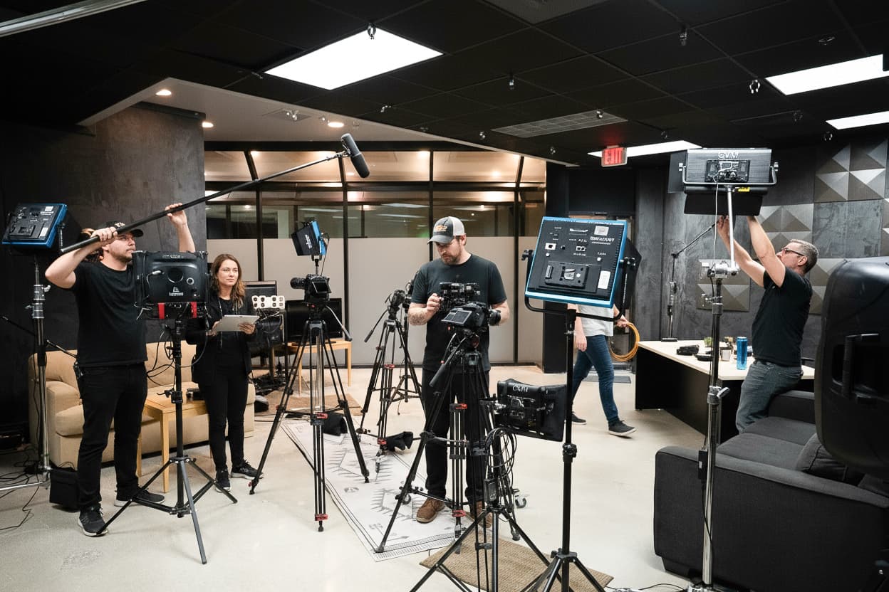 Inside the Beverly Hills Content Studio — production crew on set with cameras, lights, and audio gear