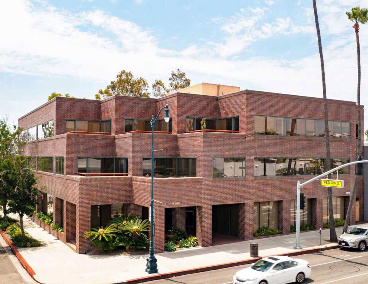 The Beverly Hills Content Studio building — a three-story brick building on Wilshire Blvd